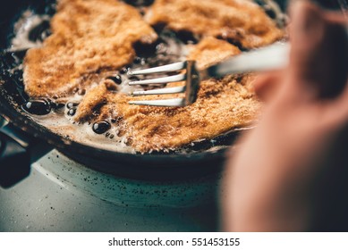 Woman Frying Chicken On Frying Pan
