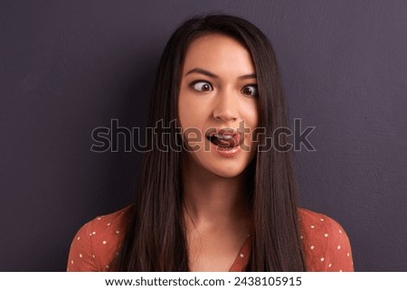 Woman, funny face and studio for comedy tongue out or mockup space, grey background or humor. Female person, model and crazy emoji as meme for comic reaction with goofy good mood, carefree or squint
