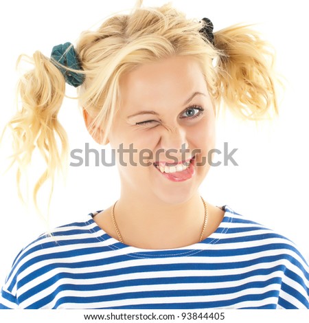 Woman with a funny look on her face smiles over a white background.