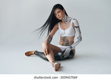 Woman From Future. Futuristic Creative Avant-garde Cyber Body Art At The Girl With Artificial Leg. People With Special Needs Concept