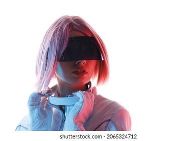 Woman In Futuristic Costume. Girl In Glasses Of Virtual Reality While Touching Air. Augmented Reality Game, Future Technology, AI Concept. VR. Neon Blue And Red Light. White Background.