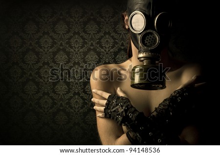 Woman with gas mask in a grunge background