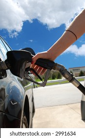 A Woman At The Gas Pump