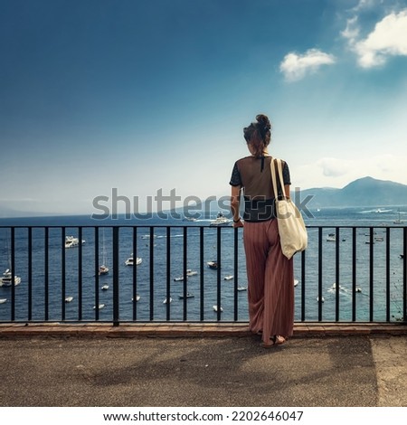 Woman gazing upon the horizon far away closeup
