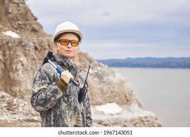 Woman Geologist On The Background Of The Open Pit On The Edge Of A Mountain