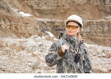 Woman Geologist On The Background Of The Slope Of The Quarry