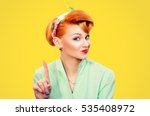 woman gesturing a no sign. Closeup portrait unhappy, serious pinup retro style girl raising finger up saying oh no you did not do that yellow background. Negative emotions facial expressions, feelings