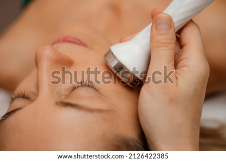 Woman get facial hydro microderm abrasion peeling treatment therapy. Cosmetic beauty Spa salon. Hydra Vacuum Cleaner