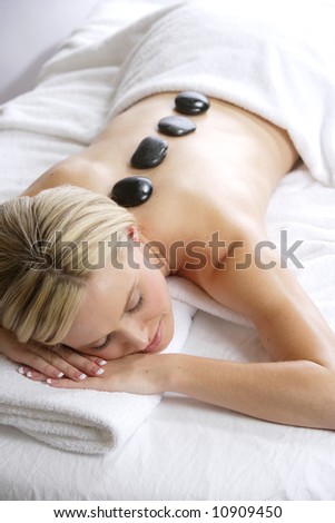 A Woman Gets A Hot Stone Massage At A Day Spa A Woman Gets A Hot Stone Massage At A Day Spa