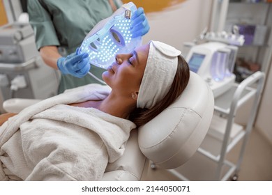 Woman Getting Cosmetic Procedure With LED Facial Mask. , Photon Therapy