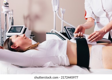 Woman Getting Ems Treatment On Abdomen To Burn Fat And Build Muscles, Slimming Technology