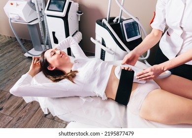 Woman Getting Ems Treatment On Abdomen To Burn Fat And Build Muscles, Slimming Technology