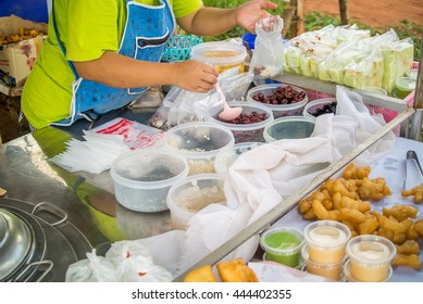 Woman Is Getting Food To Pack Soy Milk Bag.