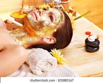 Woman Getting  Gold Facial Mask.