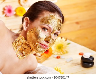 Woman Getting  Gold Facial Mask.