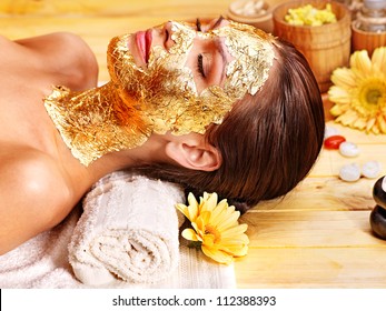 Woman Getting  Gold Facial Mask.