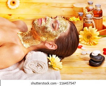 Woman Getting  Gold Facial Mask.