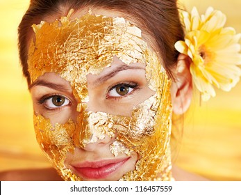 Woman Getting  Gold Facial Mask.