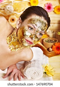 Woman Getting  Gold Facial Mask.