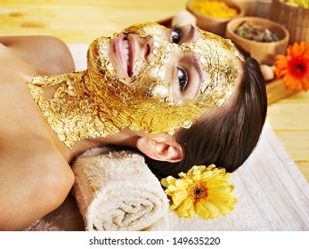 Woman Getting  Gold Facial Mask.