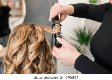 woman getting her hair done in beauty salon - Powered by Shutterstock