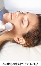 Woman Getting High Frequency Skin Treatment In Spa