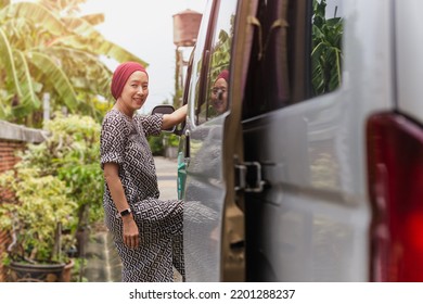 Woman getting into a bus on road trip vacation - Shutterstock ID 2201288237