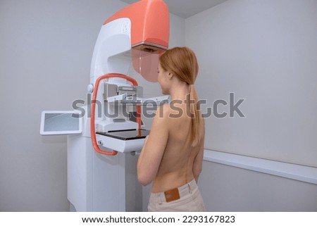 Woman getting medical test to prevent breast cancer and promoting awareness to get early mammograms