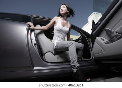 Woman Getting Out Of A Car