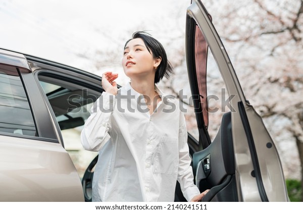 Woman getting out of\
car