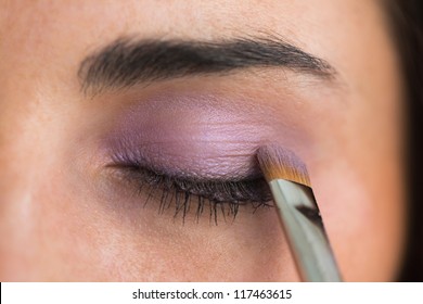 Woman Getting Purple Eye Shadow Applied