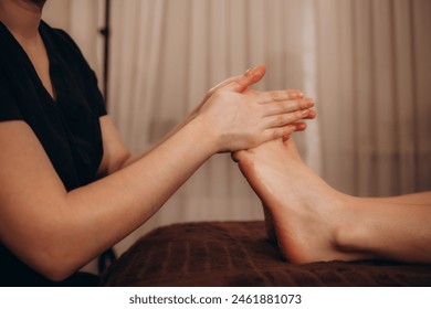 Woman getting relaxing feet massage with oils after long day - Powered by Shutterstock