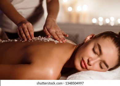 Woman Getting Salt Scrub Treatment In The Health Spa