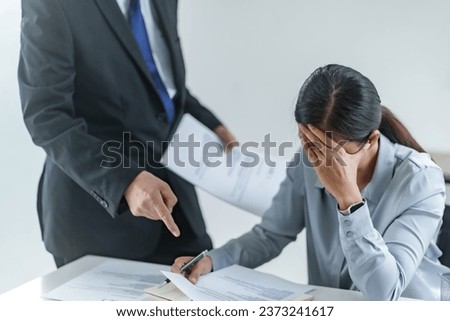 woman Getting scolded by mentor boss in the office
