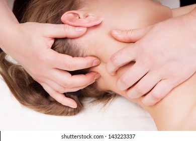 A Woman Getting A Stress Relieving Pressure Point Massage On Her Neck By A Therapist