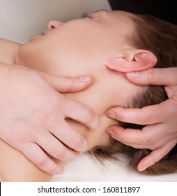 A Woman Getting A Stress Relieving Pressure Point Massage On Her Neck By A Health Therapist