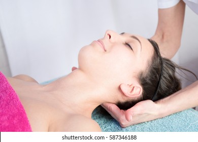 A Woman Getting A Stress Relieving Pressure Point Massage On Her Neck By A Health Therapist