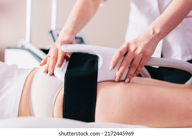 Woman getting treatment on buttocks to burn fat, build muscles and remove cellulite. Professional beauty salon - Shutterstock ID 2172445969