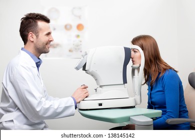 Woman Getting Visual Field Test Done By The Optometrist