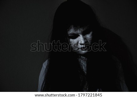 Woman ghost horror scary close up her face, Female in zombie white dressed scary costume, Halloween festival day concept