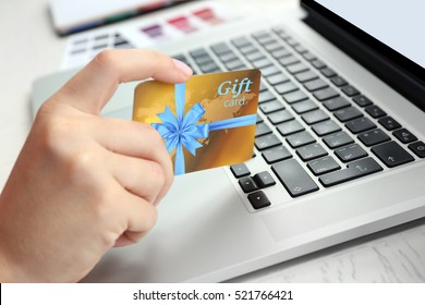 Woman With Gift Card And Laptop, Closeup. Shopping Online. Holiday Celebration Concept.