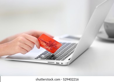 Woman With Gift Card And Laptop, Closeup. Shopping Online. Holiday Celebration Concept.