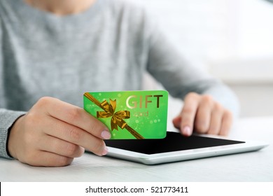 Woman With Gift Card And Tablet, Closeup. Shopping Online. Holiday Celebration Concept.
