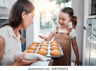 Woman, girl and baking muffins in home, happiness and sweet treat with mother or fresh dessert. Cupcakes, kitchen and childhood with parent for bonding, family and weekend break with people together - Powered by Shutterstock