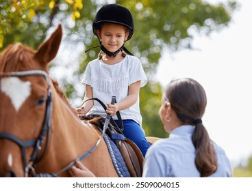 Woman, girl and happy for horse riding lesson with learning, advice and talking at ranch in summer. People, teacher and child with support, care and development at field, smile and farm in Argentina - Powered by Shutterstock