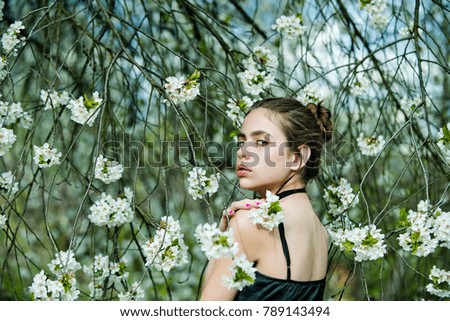 Similar – Woman posing in field of white flowers