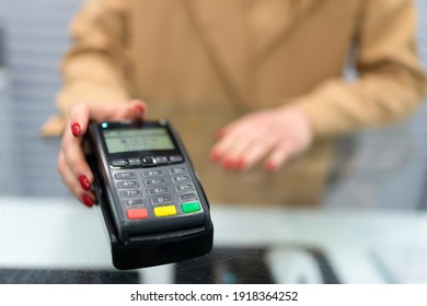 Woman Gives Payment Terminal To Client