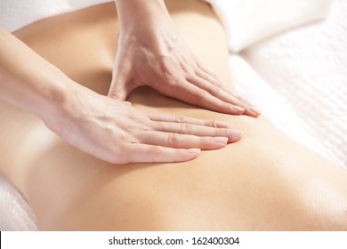 Woman Giving Back Massage To A Girl