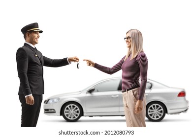 Woman Giving Car Keys From A Silver Car To A Chauffeur Isolated On White Background