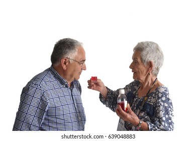 A Woman Giving Her Partner Medication